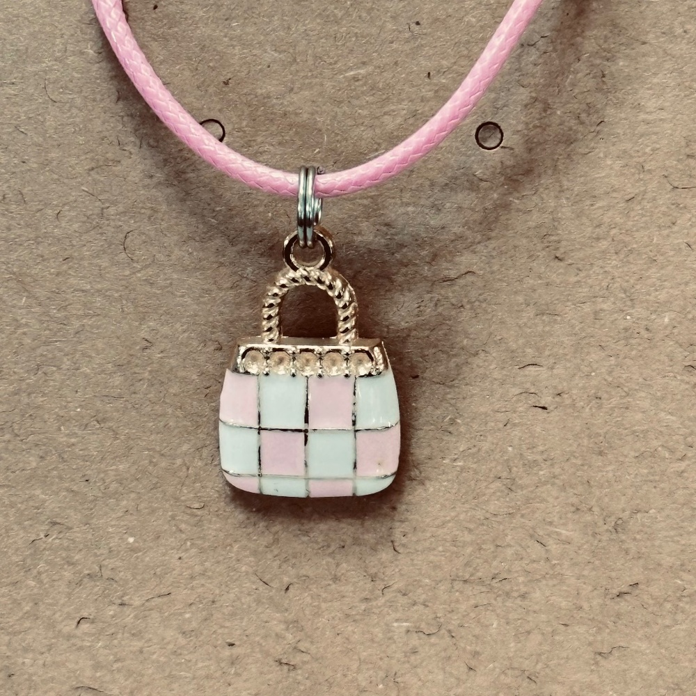 2/$15 Gold tone, purse charm with pink and white enamel checkerboard pattern.
